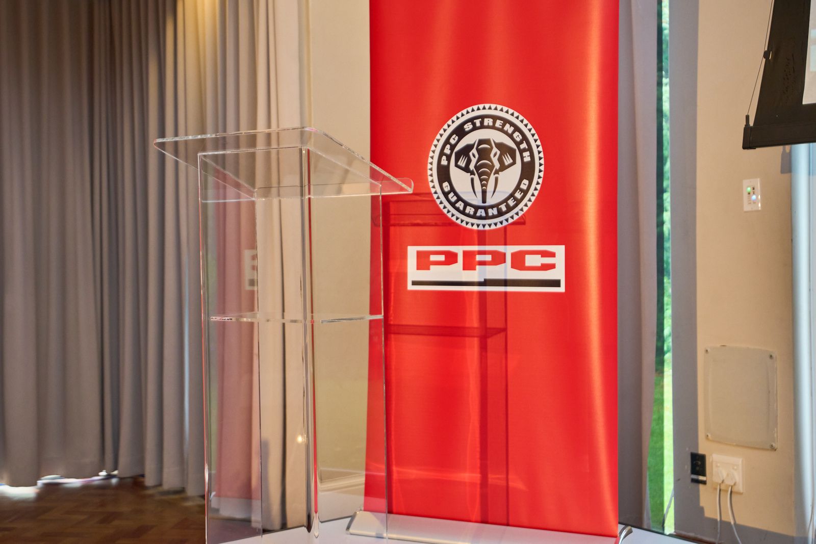 The PPC banner beside the podium