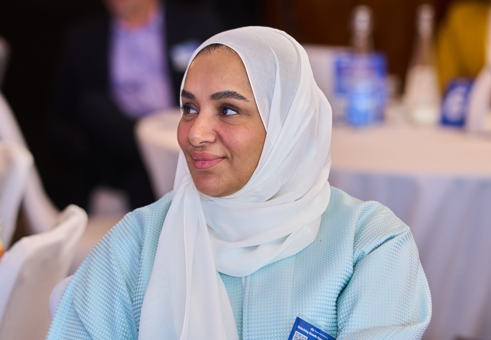 A delegate laughing during a session