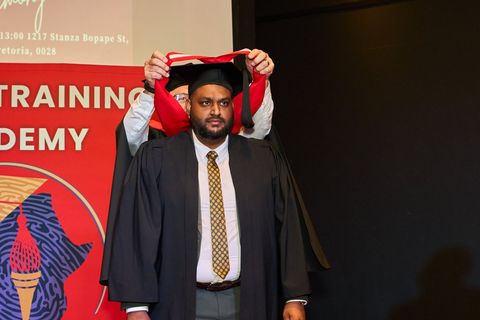 Graduate with certificate at Africa Training Academy